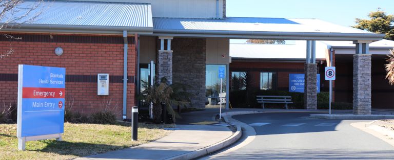 Main entry to the Bombala Multipurpose Service. A sign indicating the main and emergency entry points is on the left side of the image.