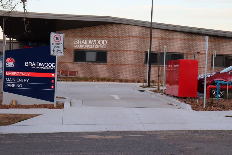 Main entry to the Braidwood Multipurpose Service. A sign indicating the main and emergency entry points is on the left side of the image.