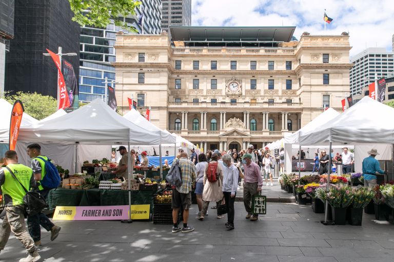 A farmers market scene during the day in the quay quarter