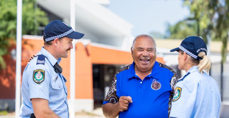 Uncle Garry smiling and talking with police officers