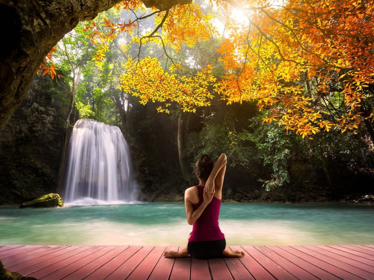 Lady Meditating By Waterfall
