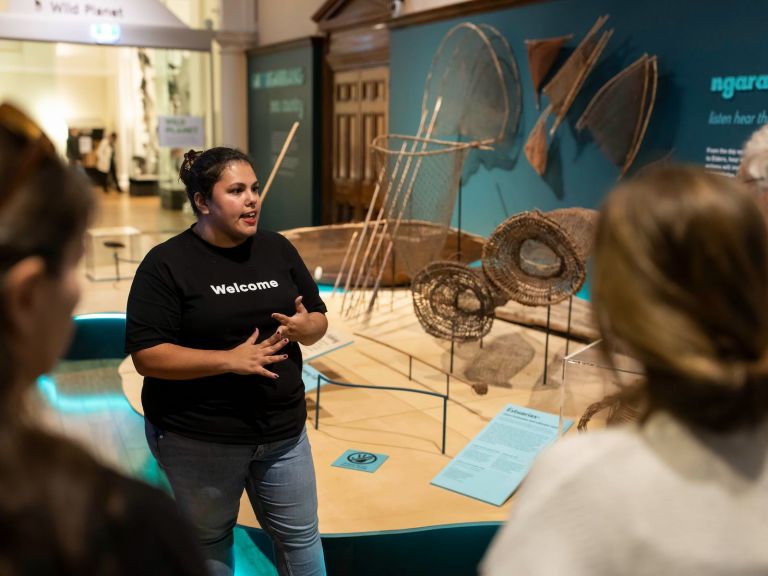 A First Nations guide leading a Waranara Tour at the Australian Museum.