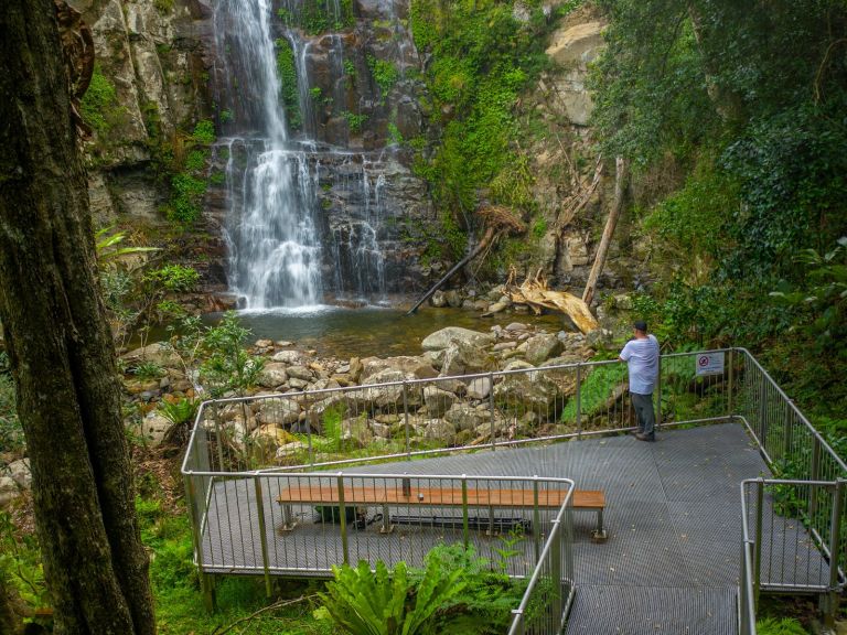 A man stands at a viewing platform along The Falls walk in Buderoo National Park.