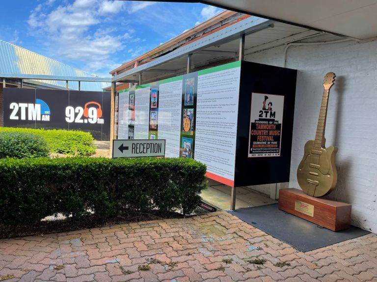 the 2TM Golden Guitar award statue and history wall