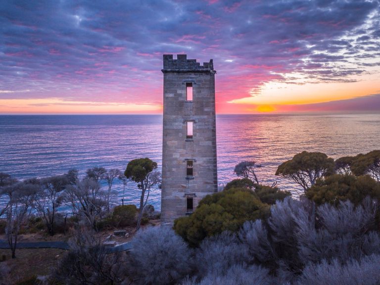 Sun rising over Boyd Tower on Red Point in the Ben Boyd National Park, Edrom
