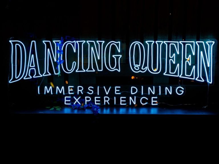 Dancing Queen Immersive Dining Experience in neon lights