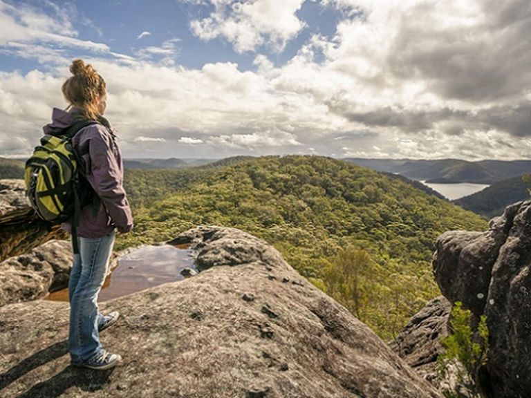 Woman standing at Point Loop lookout, Muogamarra Nature Reserve. Photo: John Spencer/DPIE