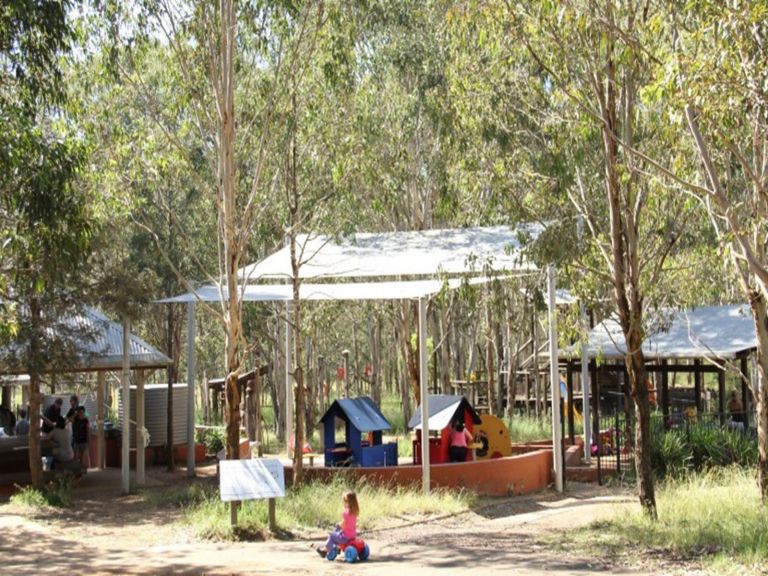 Family picnic and adventure playground area overlooking a toddlers' play space in Rouse Hill
