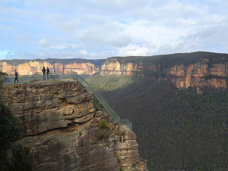 Three people at Pulpit Rock lookout's lower viewpoint, Blue Mountains National Park. Photo: E