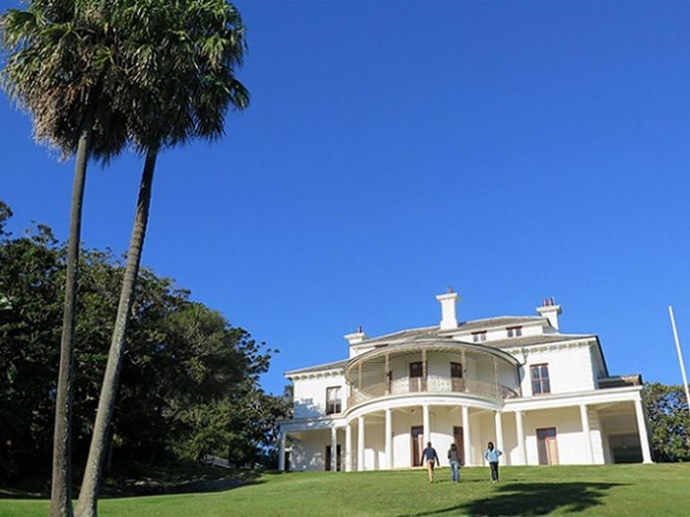 People walking up the lawn to Strickland House, Sydney Harbour National Park. Photo: E Sheargold/OEH