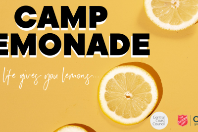 Orange background, two Lemon halves Words Camp Lemonade When life gives you lemons