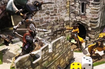 Plastic figurines and dice on tabletop