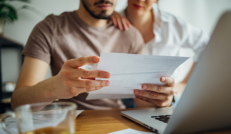 Couple looking at energy account bill