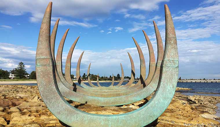 Sculpture of whale bones on the beach.