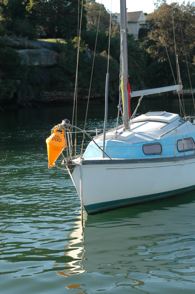 Anchored boat with yellow bouy