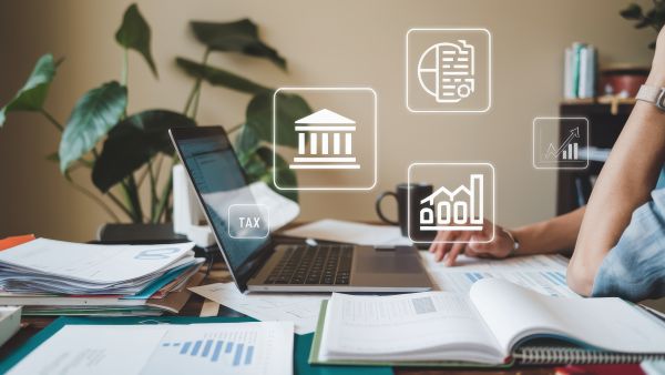 Person working on financial documents and tax reports