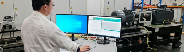TestSafe image of man in white coat using computer testing