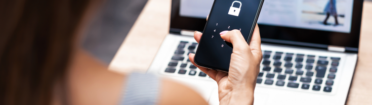 Woman typing password into a mobile phone