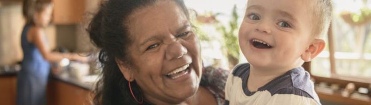 Photo of Aboriginal and Torres Strait Islander grandma with grandchild in kitchen