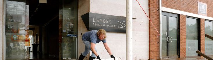 Cleaning up after flood outside Lismore Regional Gallery