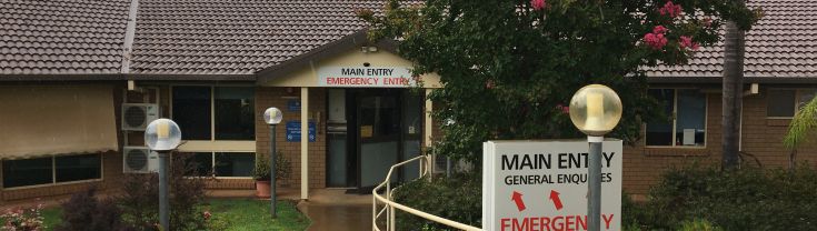 Main entry to the Coolamon-Ganmain Multipurpose Service. A sign indicating the main and emergency entry points is shown in centre