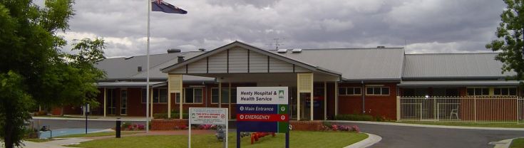 Main entrance to the Henty Multipurpose Service. A sign indicating the main and emergency entry points is positioned in front of the entrance.