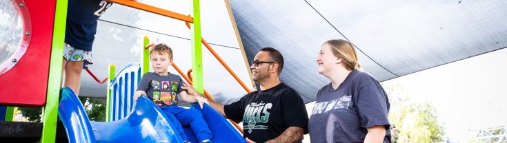 Aboriginal family at a children's playground