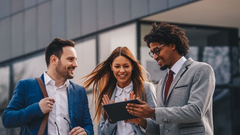 Business people looking at a tablet computer