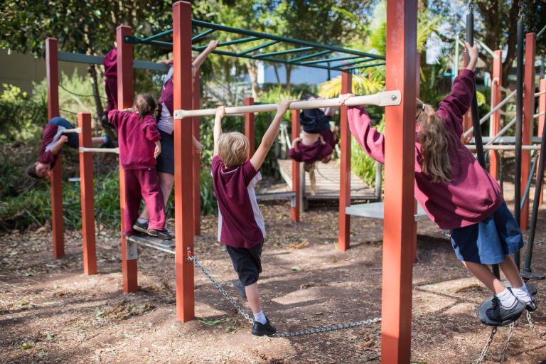 Children playing on the playground at Coramba public school in Coffs Harbour.