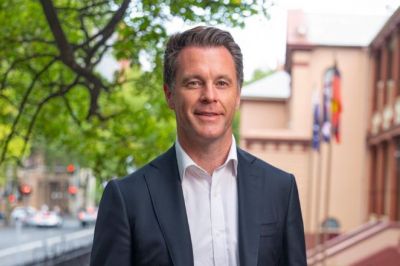 A headshot of NSW Premier Chris Minns outside